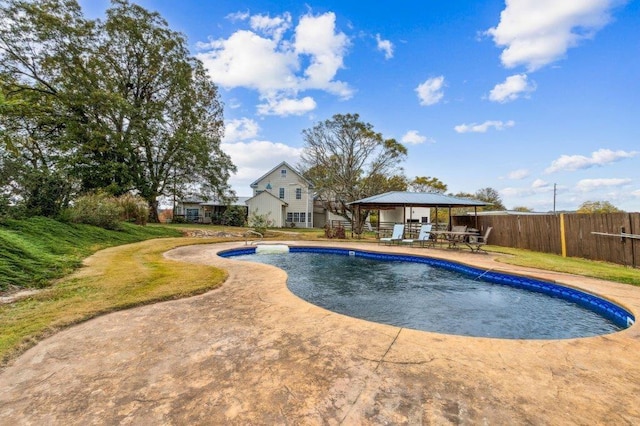 view of swimming pool with outdoor dining area, a gazebo, fence, a fenced in pool, and a patio