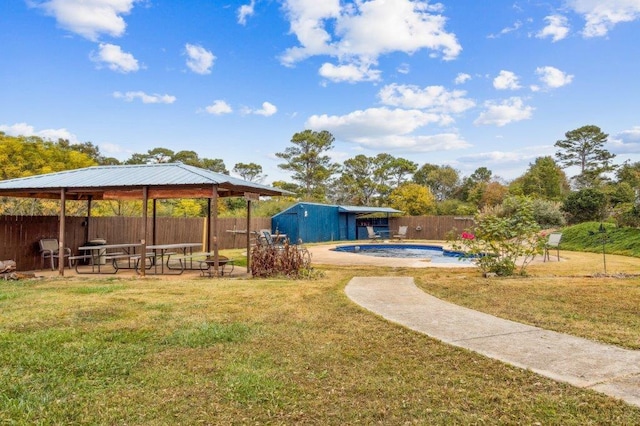 view of yard featuring a gazebo, a fenced in pool, and a fenced backyard