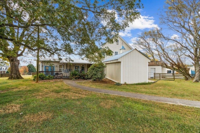 exterior space with fence and a yard