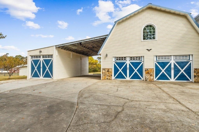 garage featuring driveway and a garage