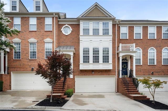 4855 Payson Ter SE Unit 3, Atlanta, GA 30339 - view of front of home featuring concrete driveway, an attached garage, and brick siding