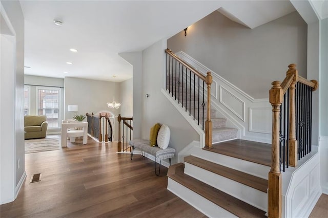 4855 Payson Ter SE Unit 3, Atlanta, GA 30339 - staircase with wood finished floors, a chandelier, and recessed lighting