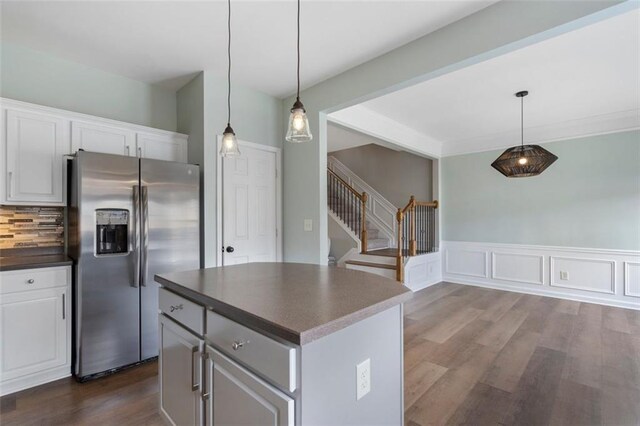 4855 Payson Ter SE Unit 3, Atlanta, GA 30339 - kitchen with stainless steel refrigerator with ice dispenser, dark countertops, tasteful backsplash, a center island, and dark wood-type flooring
