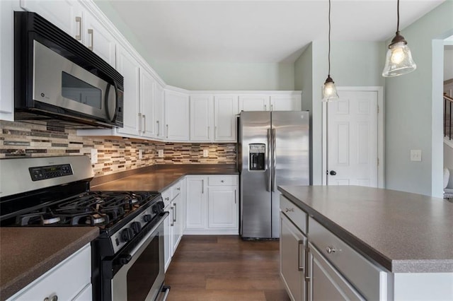 4855 Payson Ter SE Unit 3, Atlanta, GA 30339 - kitchen featuring stainless steel appliances, dark countertops, and white cabinets