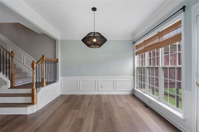 4855 Payson Ter SE Unit 3, Atlanta, GA 30339 - unfurnished dining area featuring wood finished floors, ornamental molding, wainscoting, and stairway