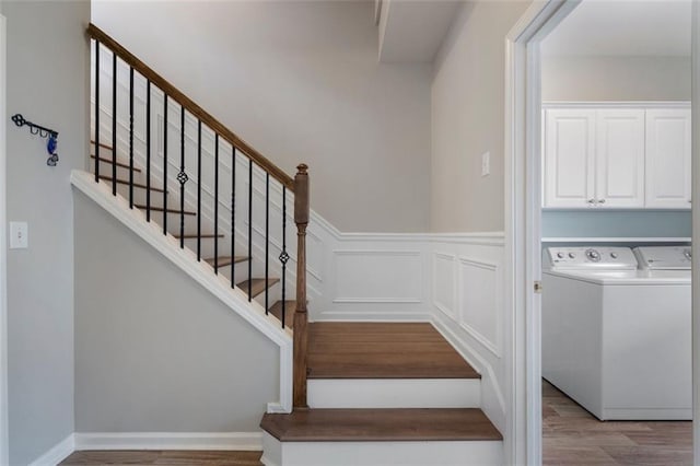 4855 Payson Ter SE Unit 3, Atlanta, GA 30339 - stairs featuring wood finished floors, washer and dryer, and wainscoting