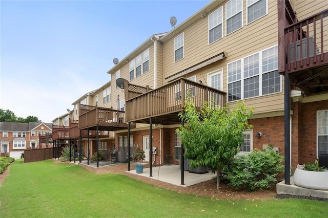 4855 Payson Ter SE Unit 3, Atlanta, GA 30339 - rear view of property with a patio area, brick siding, a lawn, central AC, and a deck