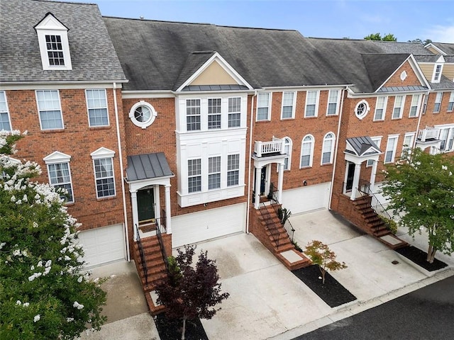 4855 Payson Ter SE Unit 3, Atlanta, GA 30339 - multi unit property featuring a garage, concrete driveway, brick siding, and a shingled roof