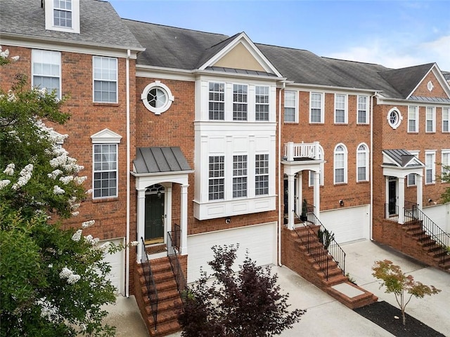 4855 Payson Ter SE Unit 3, Atlanta, GA 30339 - multi unit property with an attached garage, driveway, brick siding, and roof with shingles