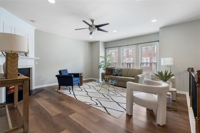 4855 Payson Ter SE Unit 3, Atlanta, GA 30339 - living area featuring wood finished floors, a fireplace with raised hearth, a ceiling fan, baseboards, and recessed lighting