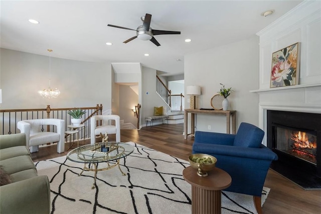 4855 Payson Ter SE Unit 3, Atlanta, GA 30339 - living room featuring wood finished floors, stairway, a glass covered fireplace, a ceiling fan, and recessed lighting