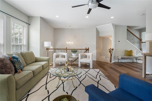 4855 Payson Ter SE Unit 3, Atlanta, GA 30339 - living area featuring wood finished floors, a chandelier, a ceiling fan, stairway, and recessed lighting