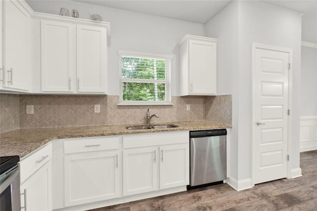 509 Grace Ln, Villa Rica, GA 30180 - kitchen with dishwasher, white cabinets, light wood finished floors, and backsplash