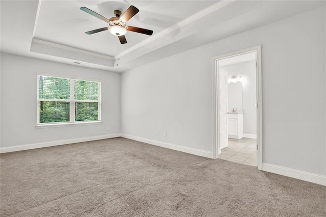 509 Grace Ln, Villa Rica, GA 30180 - carpeted empty room with a tray ceiling, crown molding, and ceiling fan