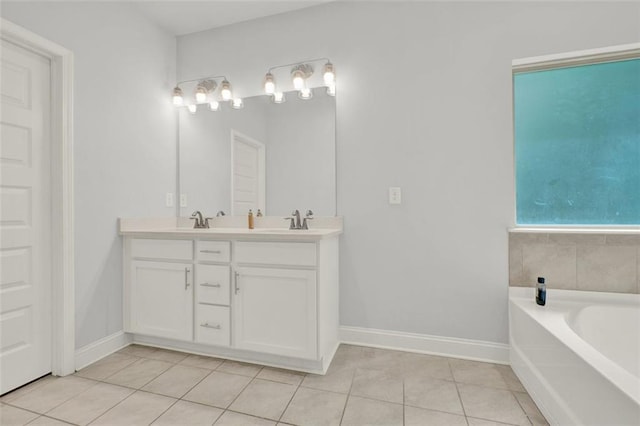 509 Grace Ln, Villa Rica, GA 30180 - bathroom featuring double vanity, tile patterned floors, and a bath
