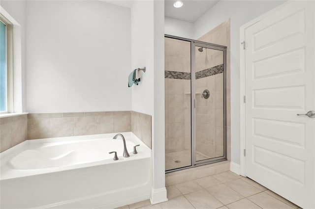 509 Grace Ln, Villa Rica, GA 30180 - bathroom with a bath, a stall shower, and tile patterned floors