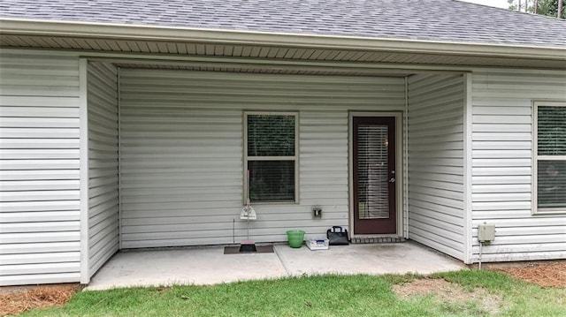 509 Grace Ln, Villa Rica, GA 30180 - doorway to property featuring a shingled roof and a patio area