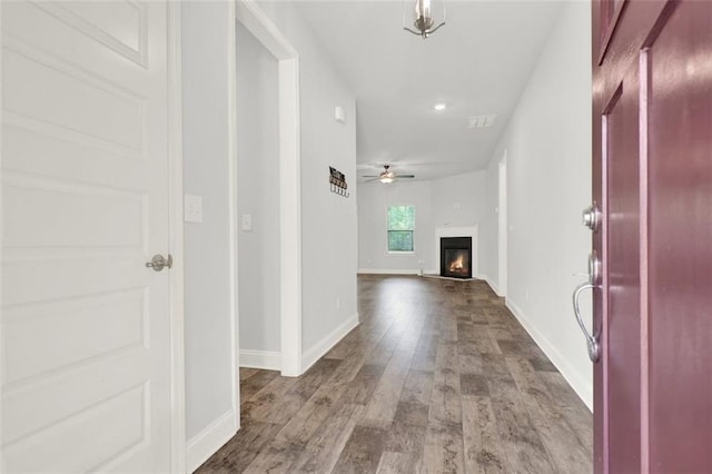 509 Grace Ln, Villa Rica, GA 30180 - foyer featuring a ceiling fan, dark wood-type flooring, and a glass covered fireplace