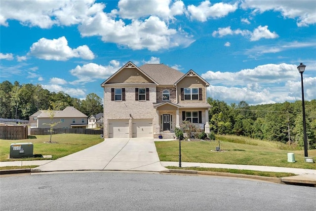 craftsman house featuring a front yard and a garage