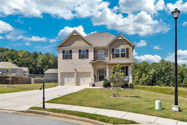 craftsman-style house featuring a garage and a front lawn