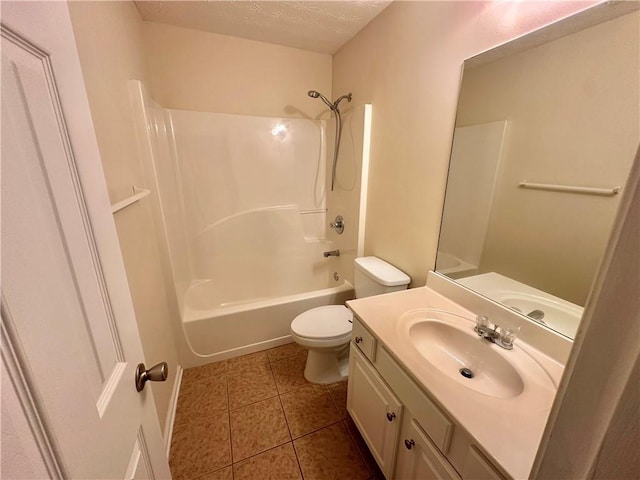 full bathroom with shower / bathtub combination, tile patterned floors, toilet, vanity, and a textured ceiling