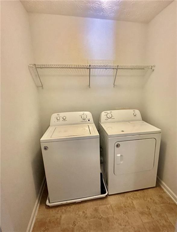 laundry room featuring washing machine and dryer