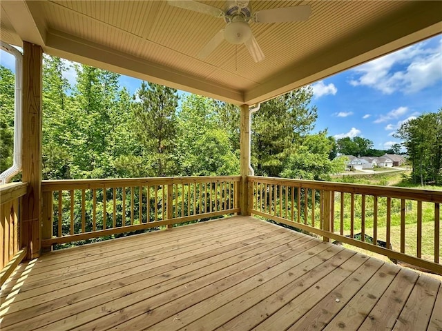 wooden terrace featuring ceiling fan