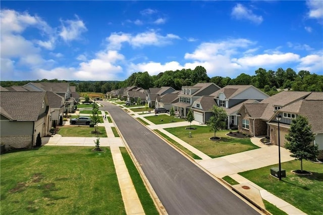 view of road with a residential view, sidewalks, and curbs