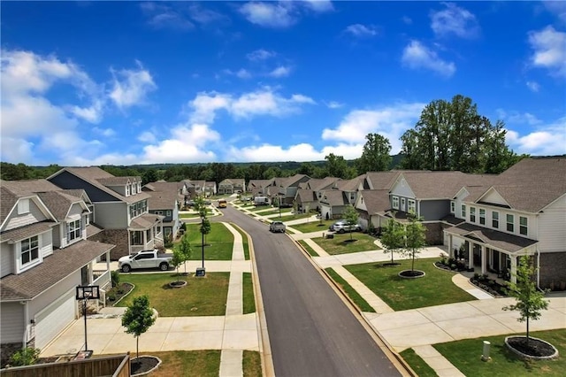 view of street featuring a residential view, sidewalks, and curbs