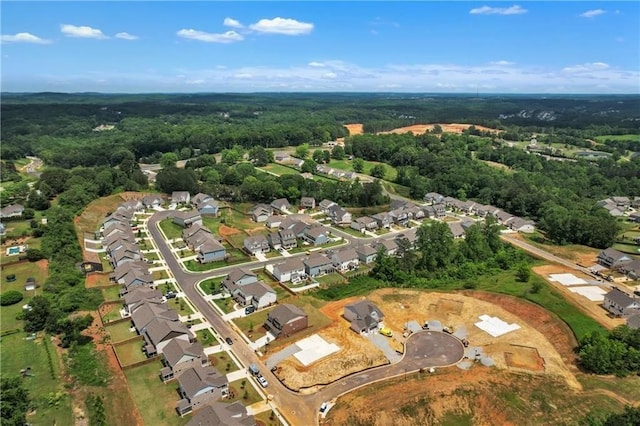drone / aerial view with a view of trees and a residential view