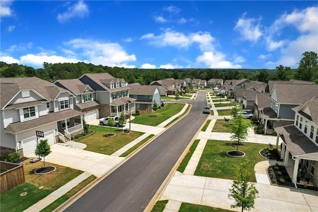view of street with curbs, sidewalks, and a residential view