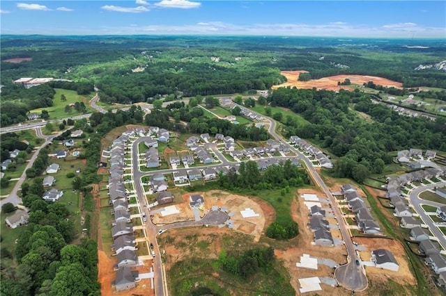 aerial view featuring a residential view and a forest view