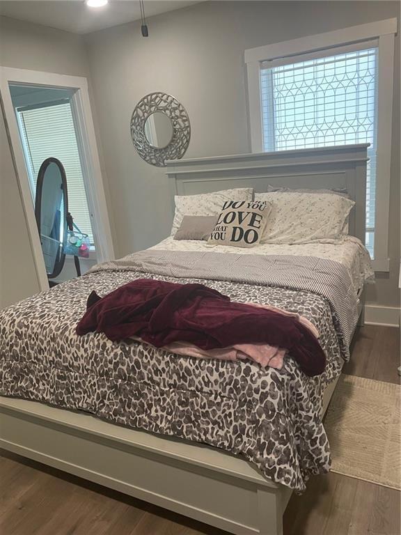 bedroom featuring dark wood-type flooring