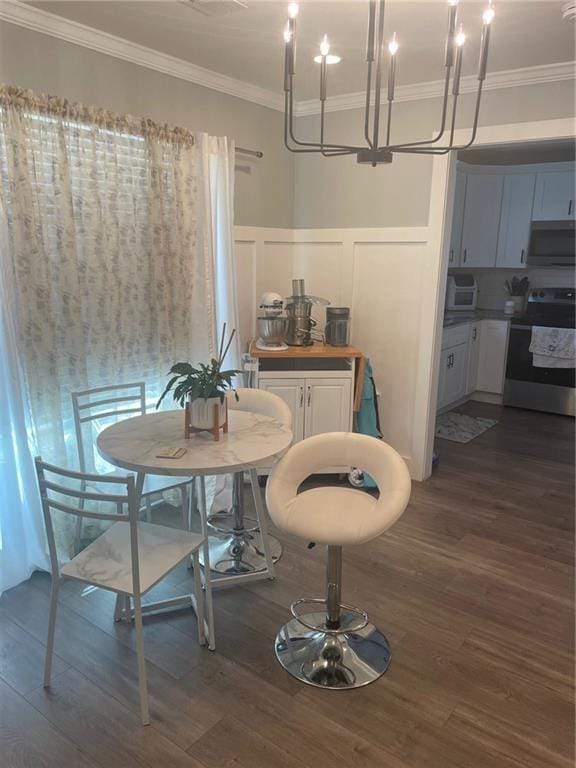 dining room with crown molding and dark wood-type flooring