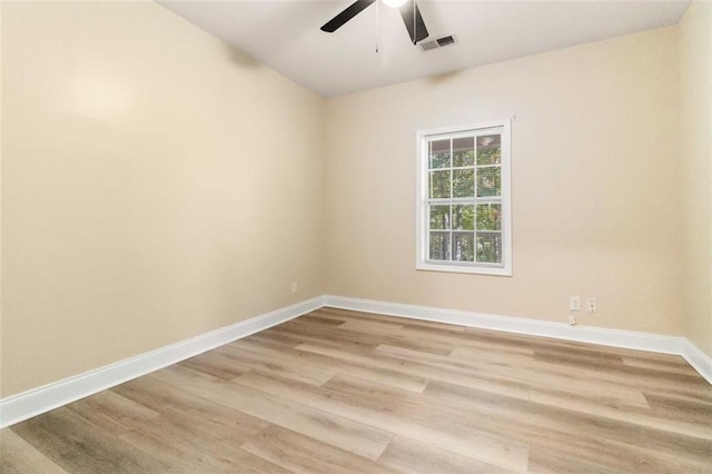 spare room featuring light wood-type flooring and ceiling fan