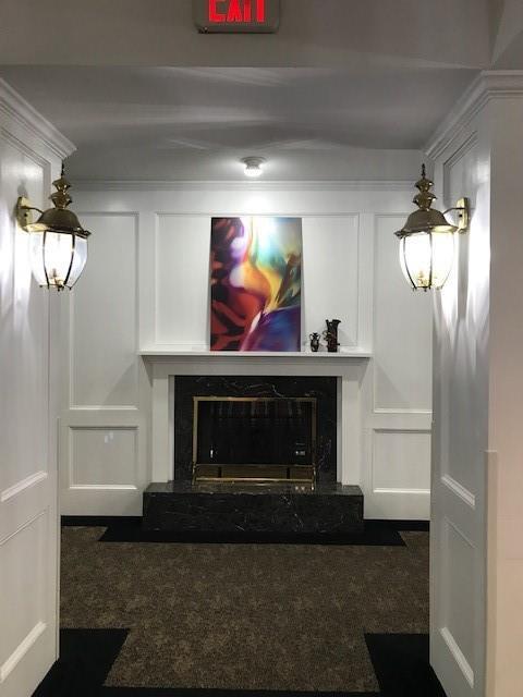 1800 Clairmont Lk Unit 313, Decatur, GA 30033 - detailed view of a decorative wall, carpet flooring, and a fireplace with raised hearth