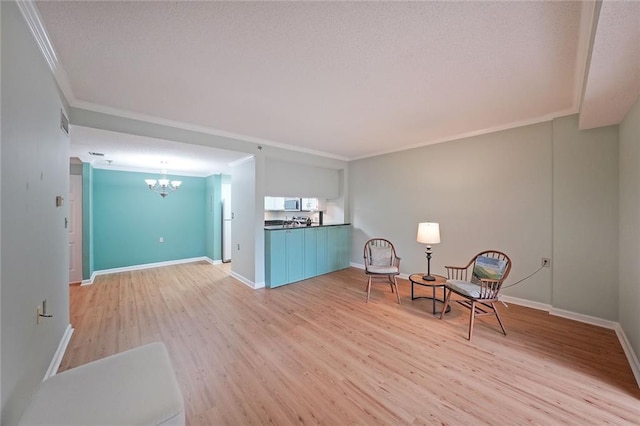 1800 Clairmont Lk Unit 313, Decatur, GA 30033 - living area with a chandelier, crown molding, light wood-style flooring, and baseboards