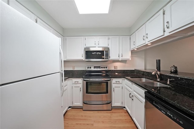 1800 Clairmont Lk Unit 313, Decatur, GA 30033 - kitchen with stainless steel appliances, a sink, and white cabinets
