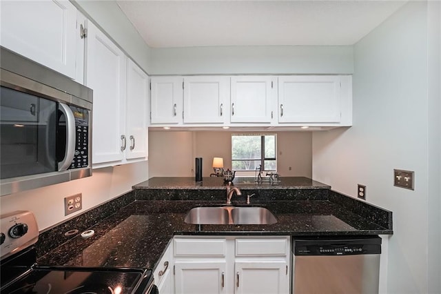 1800 Clairmont Lk Unit 313, Decatur, GA 30033 - kitchen with stainless steel appliances, a sink, and white cabinetry