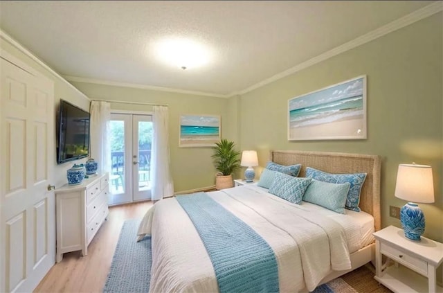 1800 Clairmont Lk Unit 313, Decatur, GA 30033 - bedroom with french doors, access to exterior, crown molding, and light wood finished floors