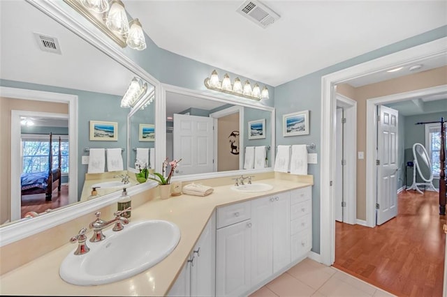 bathroom with tile patterned flooring and vanity