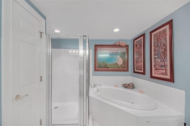 bathroom with shower with separate bathtub