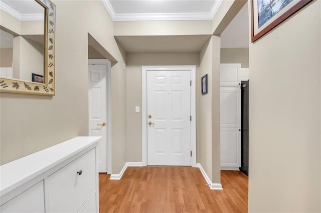 interior space featuring crown molding and light wood-type flooring