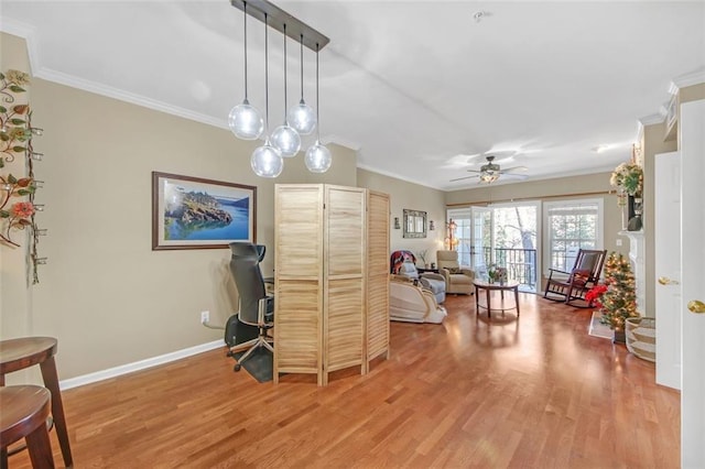 interior space with ceiling fan, wood-type flooring, and crown molding