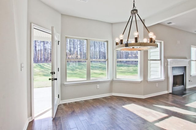 238 Linford Dr, Locust Grove, GA 30248 - unfurnished dining area with a chandelier, wood finished floors, baseboards, and beamed ceiling