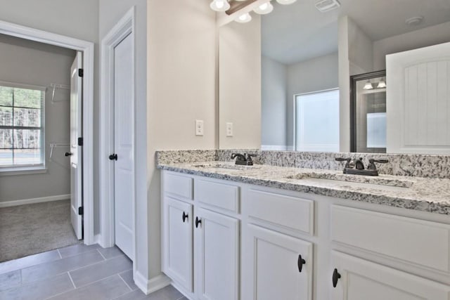 238 Linford Dr, Locust Grove, GA 30248 - full bathroom featuring double vanity, baseboards, tile patterned flooring, and a shower