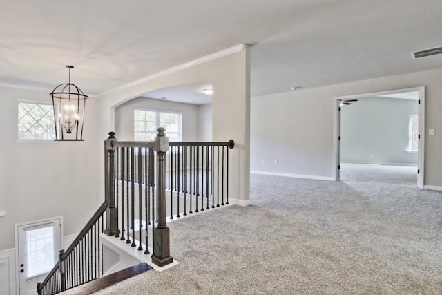 238 Linford Dr, Locust Grove, GA 30248 - hall with an upstairs landing, carpet flooring, ornamental molding, healthy amount of natural light, and baseboards