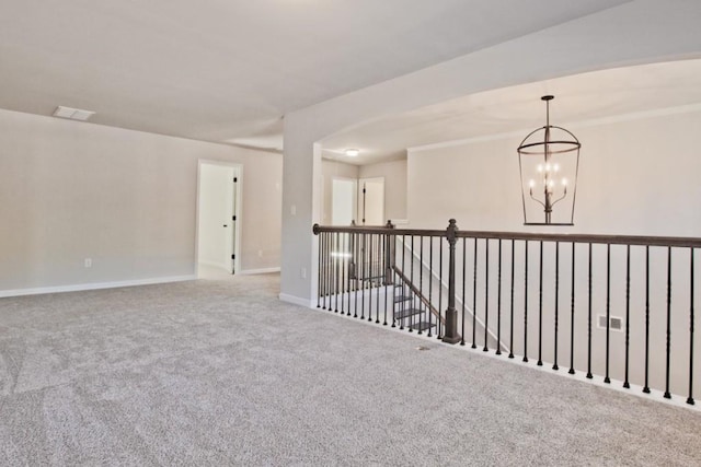 238 Linford Dr, Locust Grove, GA 30248 - spare room with a chandelier, carpet floors, and baseboards