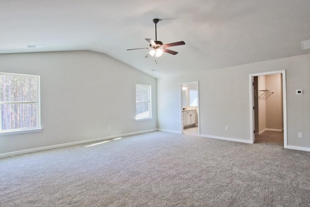 238 Linford Dr, Locust Grove, GA 30248 - unfurnished bedroom featuring vaulted ceiling, a spacious closet, carpet flooring, baseboards, and ensuite bathroom