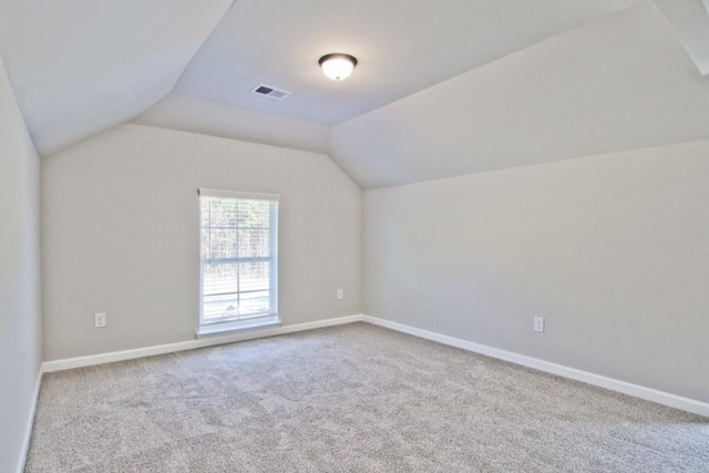 238 Linford Dr, Locust Grove, GA 30248 - additional living space with vaulted ceiling, carpet floors, and baseboards